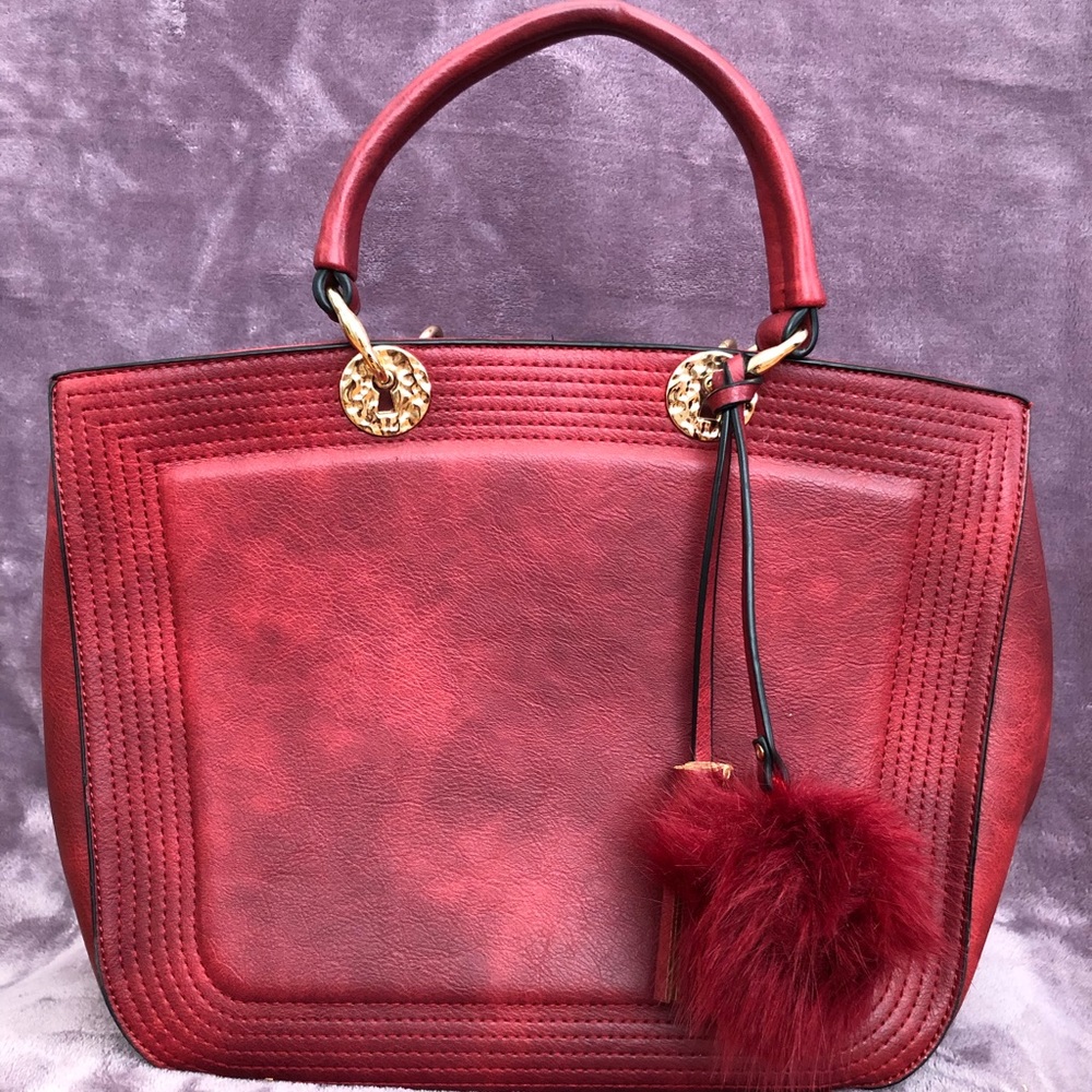 Red/smokey purse with pompon and tassel detail, only used a few times.